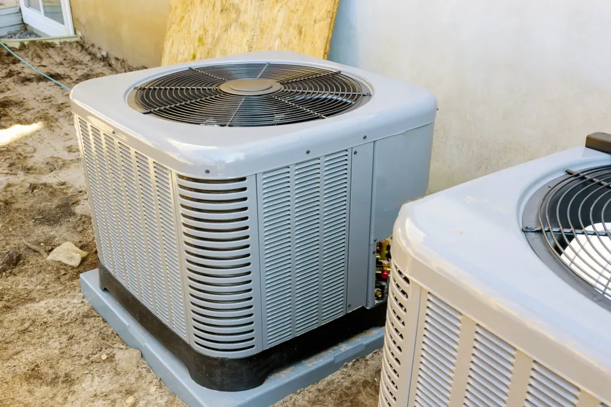 Two outdoor air conditioner condensers